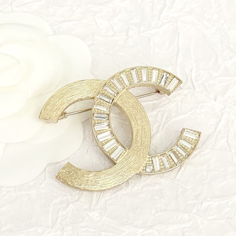 Ch*el brooches